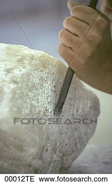 Stock Photo - man working with 
soapstone. fotosearch 
- search stock 
photos, pictures, 
images, and photo 
clipart