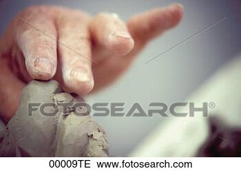 Stock Photo - modelling with 
clay. fotosearch 
- search stock 
photos, pictures, 
images, and photo 
clipart