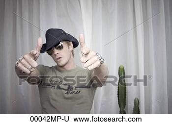 Stock Photo - urban cowboy with 
a green hot rod 
shirt, pointing 
at you. fotosearch 
- search stock 
photos, pictures, 
images, and photo 
clipart