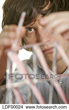 Stock Photo - man balancing 
playing cards, 
focus on man. 
fotosearch - search 
stock photos, 
pictures, images, 
and photo clipart