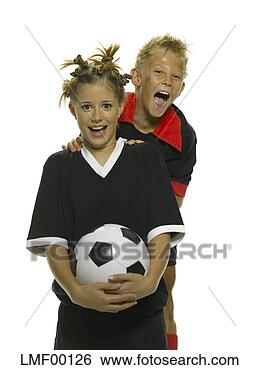Stock Photo - boy and girl holding 
football. fotosearch 
- search stock 
photos, pictures, 
images, and photo 
clipart