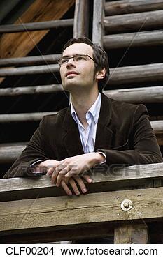 Stock Photo - man leaning on 
balustrade, portrait. 
fotosearch - search 
stock photos, 
pictures, images, 
and photo clipart