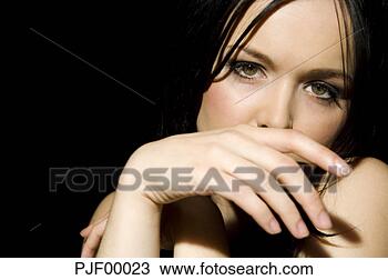Stock Photo - portrait of sexy 
woman hand to 
mouth. fotosearch 
- search stock 
photos, pictures, 
images, and photo 
clipart