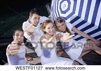 Picture - young people holding 
finger into camera. 
fotosearch - search 
stock photos, 
pictures, images, 
and photo clipart