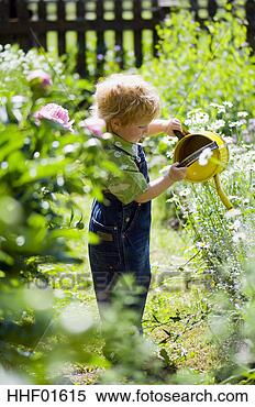 Stock Image - boy (7-8) with 
watering can, 
portrait. fotosearch 
- search stock 
photos, pictures, 
images, and photo 
clipart