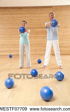 Stock Photograph - mature couple 
with gymnastic 
ball. fotosearch 
- search stock 
photos, pictures, 
images, and photo 
clipart