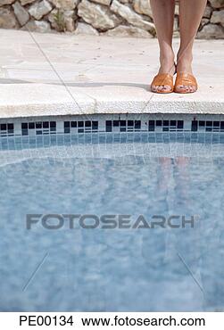 Stock Photo - woman at swimming 
pool's edge, low-section. 
fotosearch - search 
stock photos, 
pictures, images, 
and photo clipart