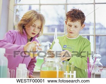 Stock Photography - boy and girl (8-11) 
in chemical lab. 
fotosearch - search 
stock photos, 
pictures, images, 
and photo clipart