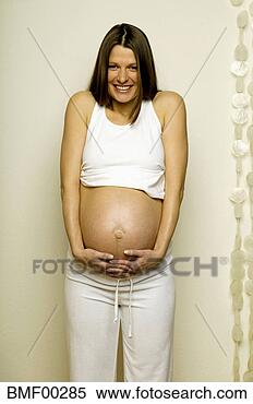 Banco de Imagem - mulher,  mãos, 
 barriga,  sorrindo, 
 retrato. fotosearch 
- busca de fotos, 
imagens e clipart