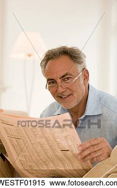 Stock Image - mature man holding 
newspaper, close-up, 
portrait. fotosearch 
- search stock 
photos, pictures, 
images, and photo 
clipart