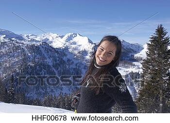 Stock Photo - young woman in 
snow, smiling. 
fotosearch - search 
stock photos, 
pictures, images, 
and photo clipart