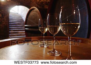 Stock Photo - white wine in 
glasses on wine 
cask. fotosearch 
- search stock 
photos, pictures, 
images, and photo 
clipart