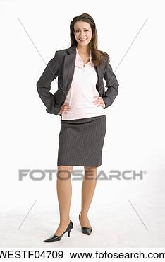 Stock Photograph - businesswoman 
standing with 
hands on hip, 
smiling, portrait. 
fotosearch - search 
stock photos, 
pictures, images, 
and photo clipart