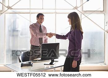 Stock Photo - businesspeople 
shaking hands. 
fotosearch - search 
stock photos, 
pictures, images, 
and photo clipart