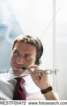 Banco de Imagem - negócio,  cabeça, 
 jogo,  skyping. 
fotosearch - busca 
de fotos, imagens 
e clipart