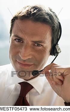 Banco de Imagem - negócio,  headset, 
 skyping. fotosearch 
- busca de fotos, 
imagens e clipart