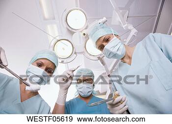Arquivo Fotográficos - cirurgia,  equipe, 
 operando,  sala. 
fotosearch - busca 
de fotos, imagens 
e clipart
