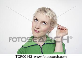 Stock Photo - portrait of a 
shy woman looking 
away. fotosearch 
- search stock 
photos, pictures, 
images, and photo 
clipart