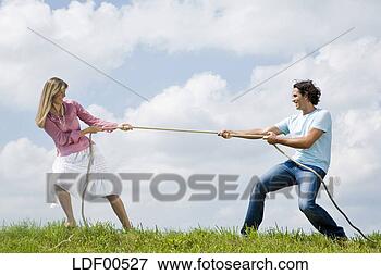 Picture - couple pulling 
rope, close-up. 
fotosearch - search 
stock photos, 
pictures, images, 
and photo clipart