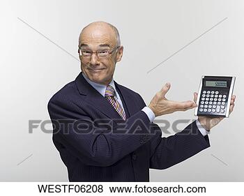 Stock Photo - businessman holding 
calculator, portrait. 
fotosearch - search 
stock photos, 
pictures, images, 
and photo clipart