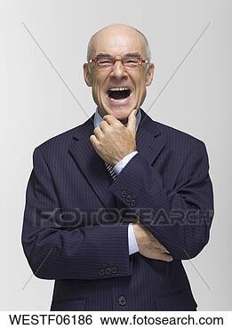 Banco de Imagem - homem negócios, 
 mão,  queixo, 
 boca,  abertos, 
 retrato. fotosearch 
- busca de fotos, 
imagens e clipart