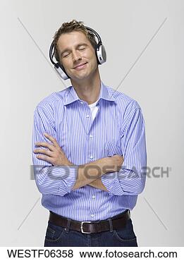 Banco de Imagem - jovem,  desgastar, 
 fones,  escutar, 
 música,  retrato. 
fotosearch - busca 
de fotos, imagens 
e clipart