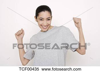 Banco de Imagem - jovem,  mulher, 
 agarrar,  punhos, 
 sorrindo,  retrato, 
 close-up. fotosearch 
- busca de fotos, 
imagens e clipart
