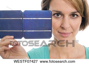 Picture - woman holding 
solar cell. fotosearch 
- search stock 
photos, pictures, 
images, and photo 
clipart