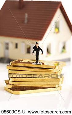 Stock Photo - plastic figurine 
in front of house. 
fotosearch - search 
stock photos, 
pictures, images, 
and photo clipart