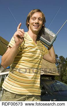Stock Photo - germany,  bavaria, 
 young man carrying 
a transistor radio 
on his. fotosearch 
- search stock 
photos, pictures, 
images, and photo 
clipart