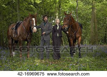 Stock Image - businesspeople 
with horses in 
forest. fotosearch 
- search stock 
photos, pictures, 
images, and photo 
clipart