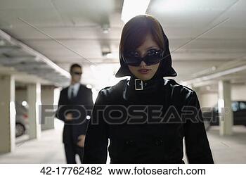 Stock Photo - mysterious woman 
in a parking garage. 
fotosearch - search 
stock photos, 
pictures, images, 
and photo clipart