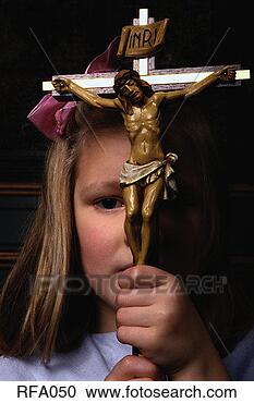 Stock Photography - girl holding crucifix. 
fotosearch - search 
stock photos, 
pictures, images, 
and photo clipart