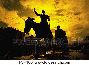 Stock Photography - statue of don 
quixote silhouetted 
at sunset. fotosearch 
- search stock 
photos, pictures, 
images, and photo 
clipart