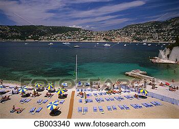 Stock Photography - beachgoers sunbathing 
along the french 
riviera. fotosearch 
- search stock 
photos, pictures, 
images, and photo 
clipart