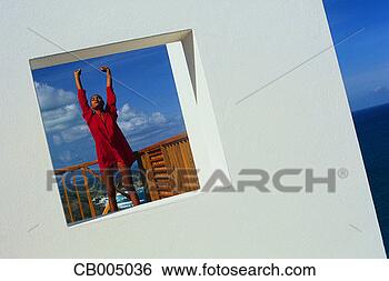 Stock Photo - view through window 
of woman stretching. 
fotosearch - search 
stock photos, 
pictures, images, 
and photo clipart