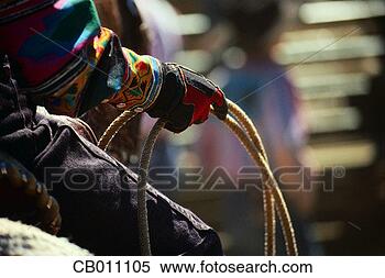 Stock Image - cowgirl's hand 
holding lasso. 
fotosearch - search 
stock photos, 
pictures, images, 
and photo clipart