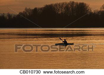 Stock Photography - lone canoeist. 
fotosearch - search 
stock photos, 
pictures, images, 
and photo clipart