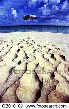 Picture - rippled beach 
and umbrella. 
fotosearch - search 
stock photos, 
pictures, images, 
and photo clipart