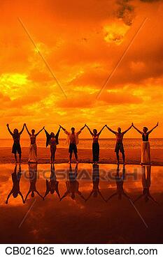 Stock Image - friends playing 
on the beach. 
fotosearch - search 
stock photos, 
pictures, images, 
and photo clipart