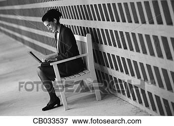 Picture - businesswoman 
sitting with laptop. 
fotosearch - search 
stock photos, 
pictures, images, 
and photo clipart