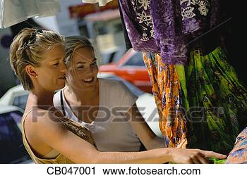 Stock Photography - two women looking 
at fabric. fotosearch 
- search stock 
photos, pictures, 
images, and photo 
clipart