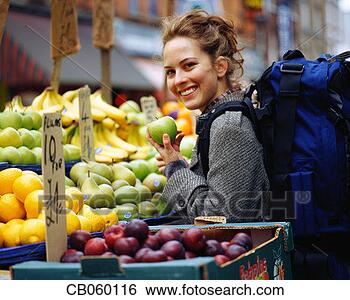 Stock Photo - backpacking student 
shopping for fruit. 
fotosearch - search 
stock photos, 
pictures, images, 
and photo clipart