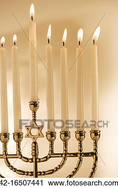 Stock Photography - menorah with burning 
candles. fotosearch 
- search stock 
photos, pictures, 
images, and photo 
clipart