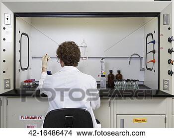 Stock Photo - scientist working 
in lab. fotosearch 
- search stock 
photos, pictures, 
images, and photo 
clipart