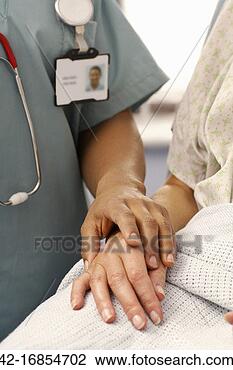 Stock Photo - nurse holding 
patient hand. 
fotosearch - search 
stock photos, 
pictures, images, 
and photo clipart