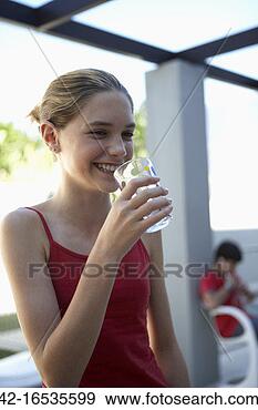Stock Photograph - pre-teen girl 
drinking water. 
fotosearch - search 
stock photos, 
pictures, images, 
and photo clipart