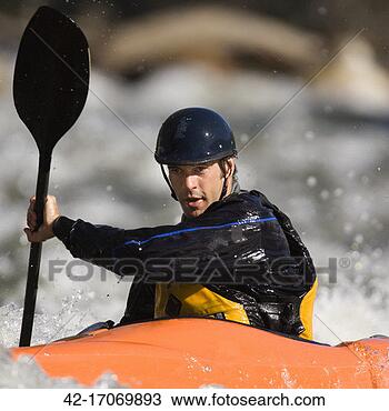 Stock Photo - whitewater kayaker 
in rapids. fotosearch 
- search stock 
photos, pictures, 
images, and photo 
clipart