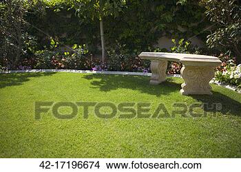 Stock Photo - bench on lawn 
in garden. fotosearch 
- search stock 
photos, pictures, 
images, and photo 
clipart