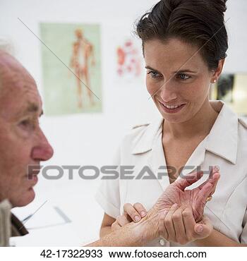 Stock Photo - nurse taking the 
pulse of an older 
man. fotosearch 
- search stock 
photos, pictures, 
images, and photo 
clipart